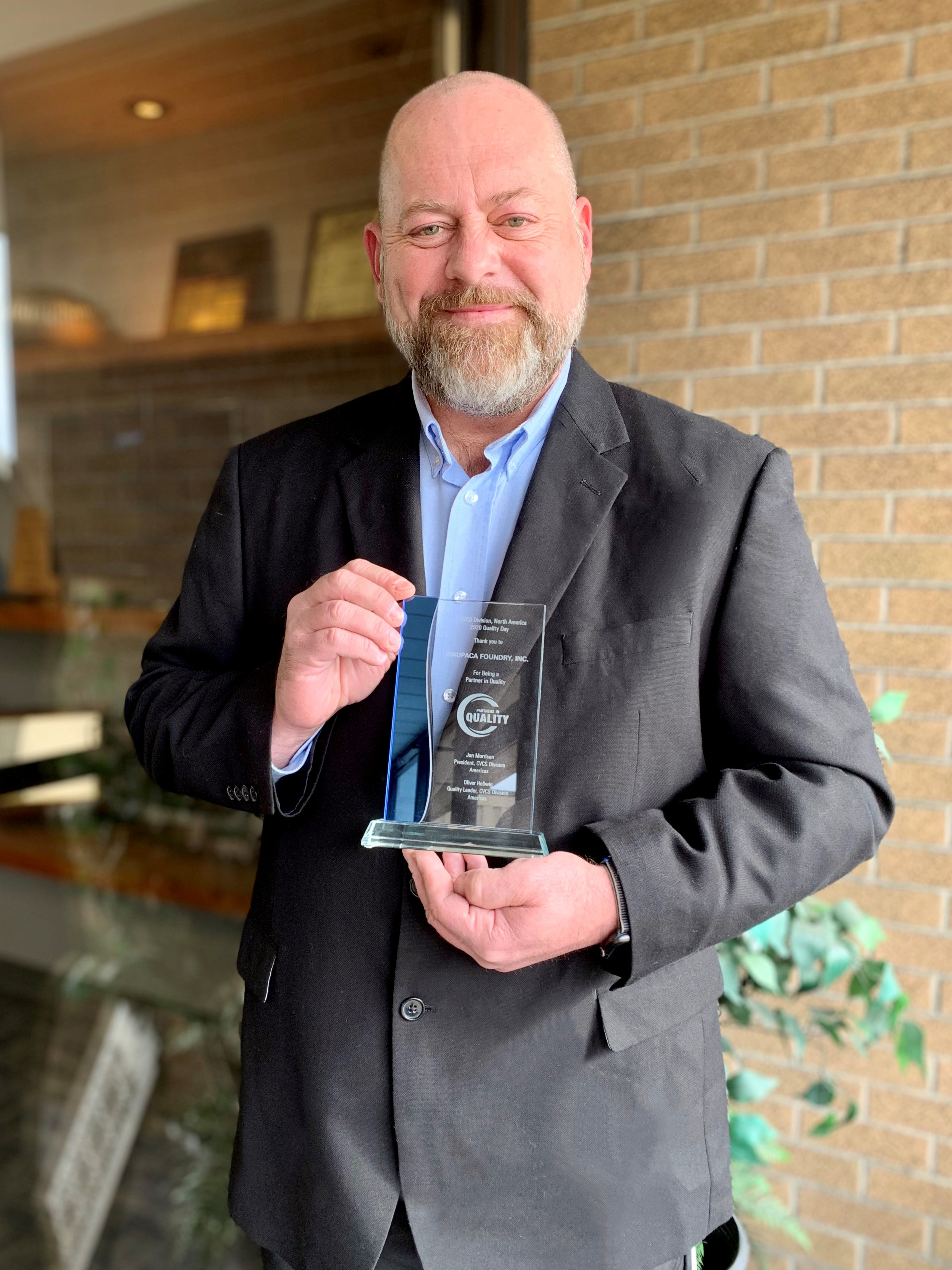 Waupaca Foundry Steve Brehmer holds Wabco Partner in Quality Award