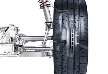 side view of automotive suspension and wheel on a white background