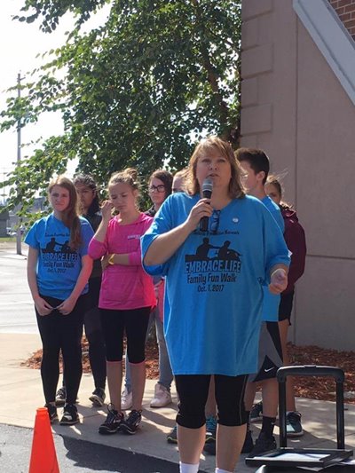 Gail Schick speaks at the annual “Embrace Life” Family/Community Fun Walk